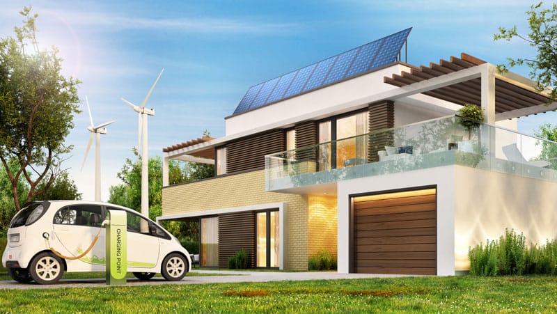 Sustainable and energy efficient home improvements. House with solor panel on roof, elctic car charging station and windmills